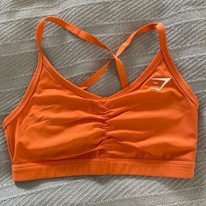 Gymshark size small, orange sports bra